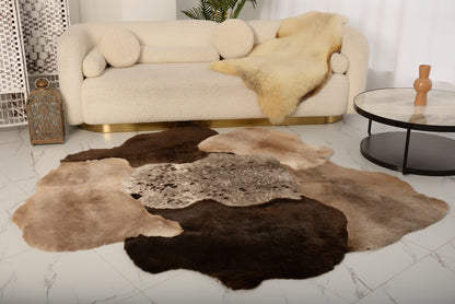 The Mossi rug is crafted from six natural sheepskins in deep brown tones.