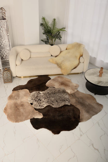 The Mossi rug is crafted from six natural sheepskins in deep brown tones.