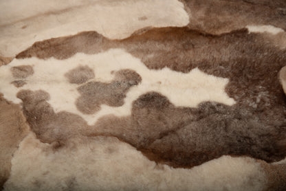 Mossi rug is crafted from six light brown trimmed sheepskins