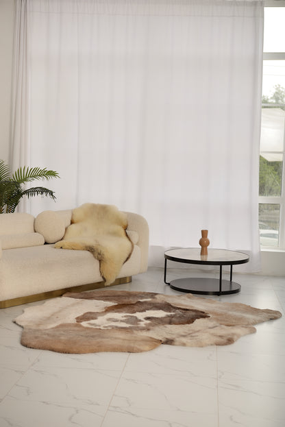 Mossi rug is crafted from six light brown trimmed sheepskins