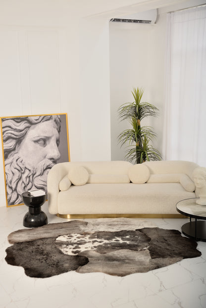 The Mossi rug in dark gray is made from six natural sheepskins.