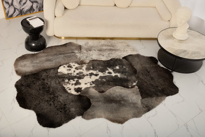 The Mossi rug in dark gray is made from six natural sheepskins.