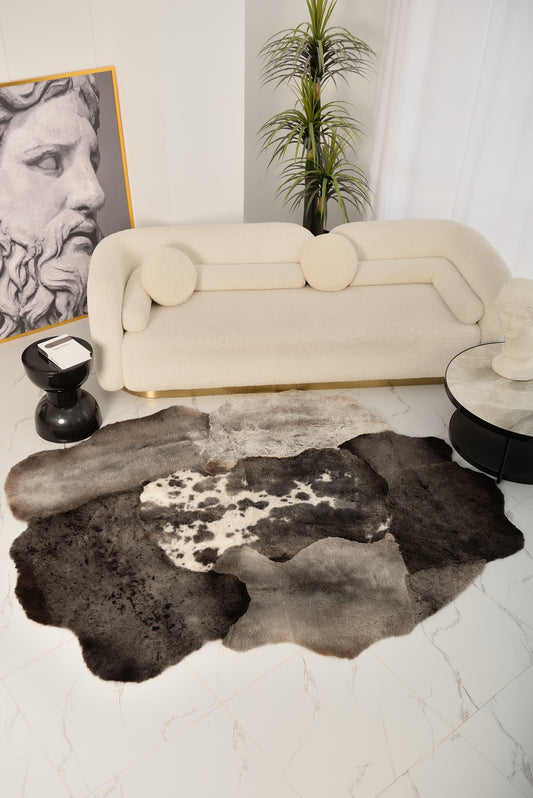 The Mossi rug in dark gray is made from six natural sheepskins.