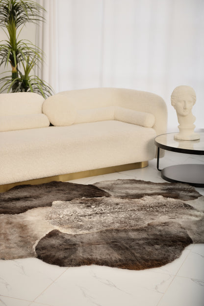 The Mossi rug in light gray is crafted from six genuine sheepskins