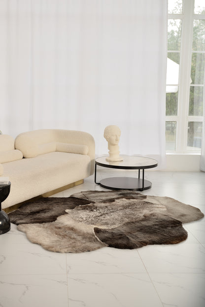 The Mossi rug in light gray is crafted from six genuine sheepskins