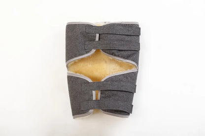 Knee pad made of warming sheepskin wool in grey color