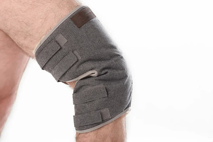Knee pad made of warming sheepskin wool in grey color