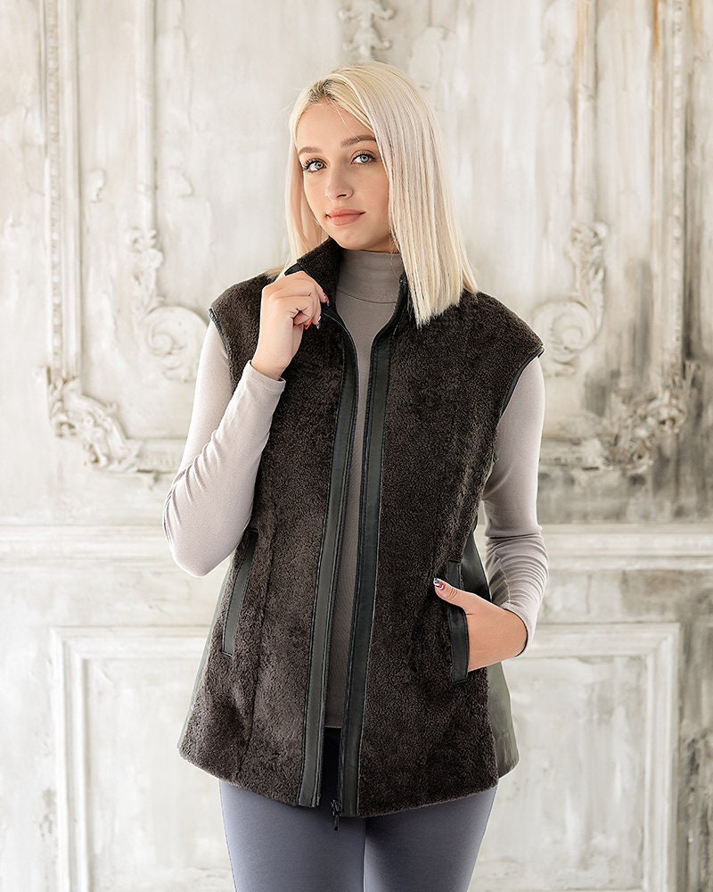 Long Shearling Gilet Womens with Short Sheepskin Outer Layer and Leather Edging